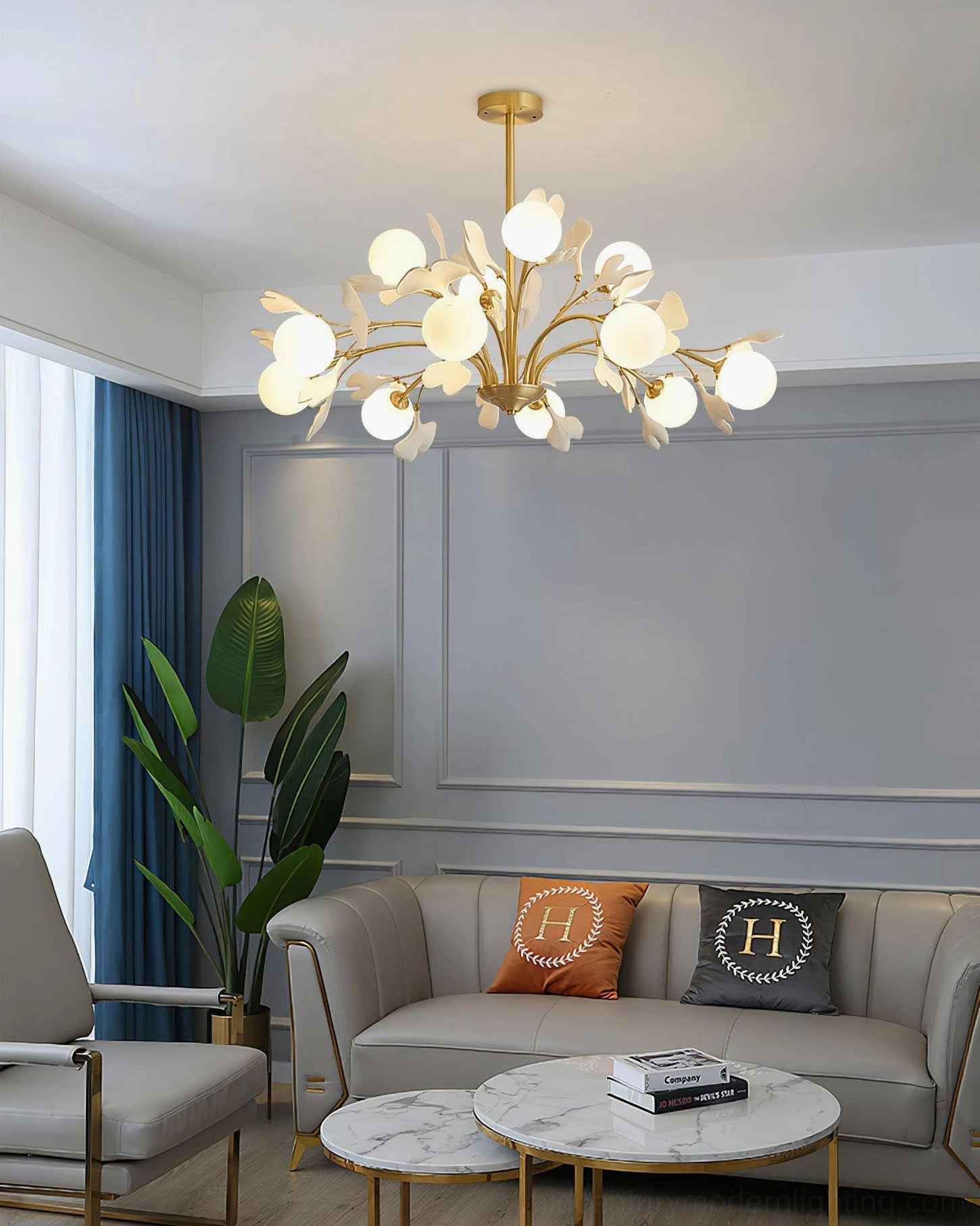 Gingko chandelier warm brass finish and natural ceramic aesthetic detail