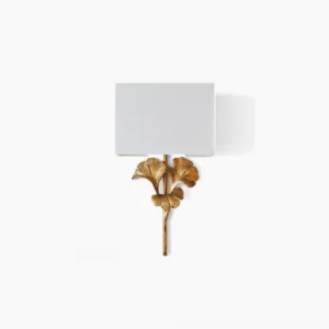 Gingko leaf vintage wall sconce with brass frame and white fabric shade on clean background