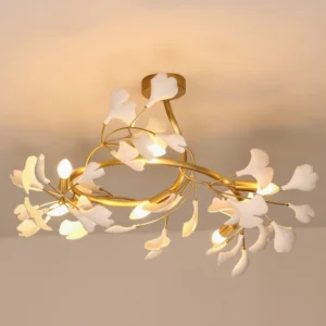 Close-up view of ginkgo ceiling lamp with ceramic leaf accents and brass frame details