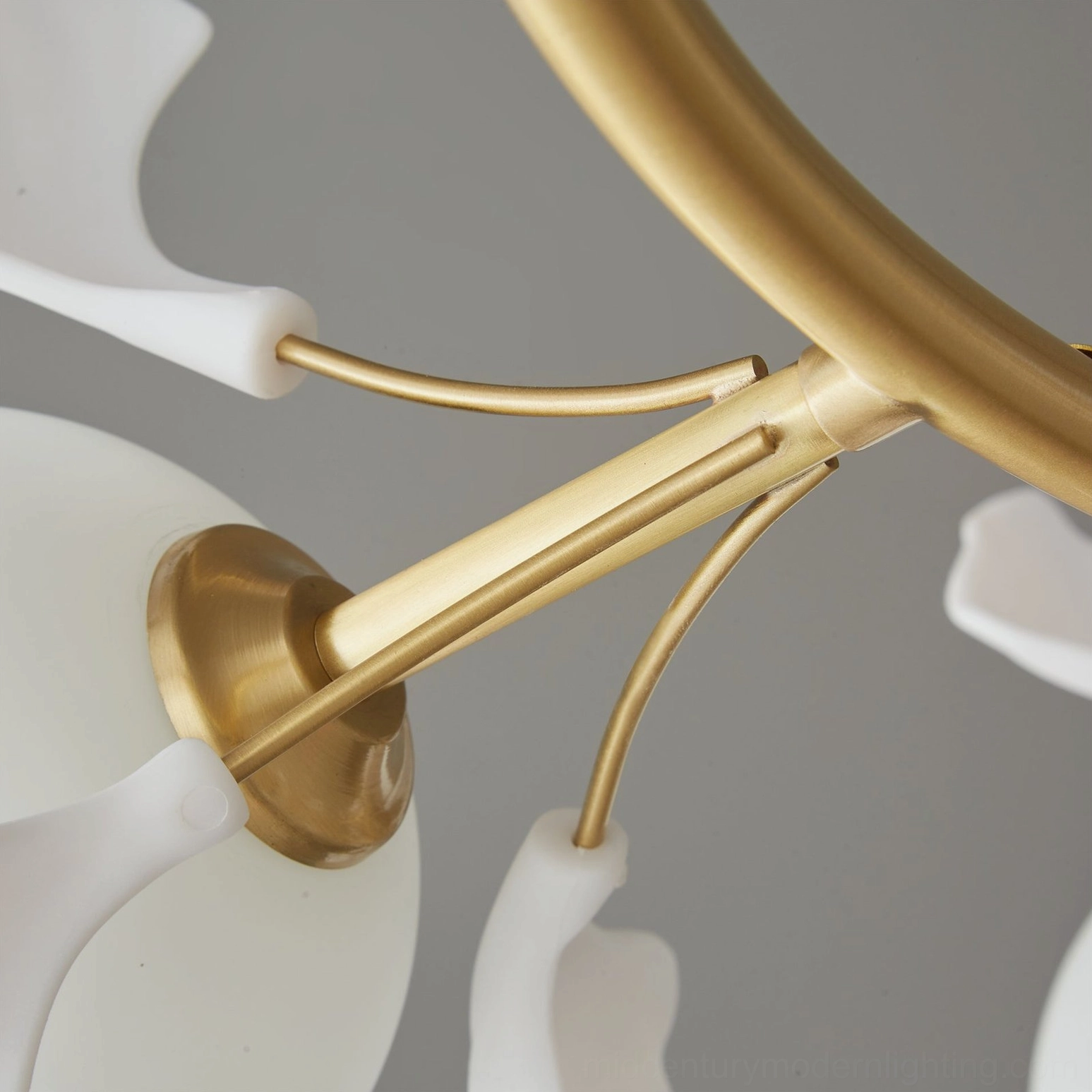 Gold hanging base and metal lamp arms detail ginkgo leaf chandelier