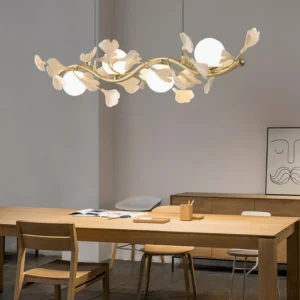 Modern dining room with Ginkgo Glass Chandelier 4-head linear fixture showing warm gold brass finish and white ceramic sockets