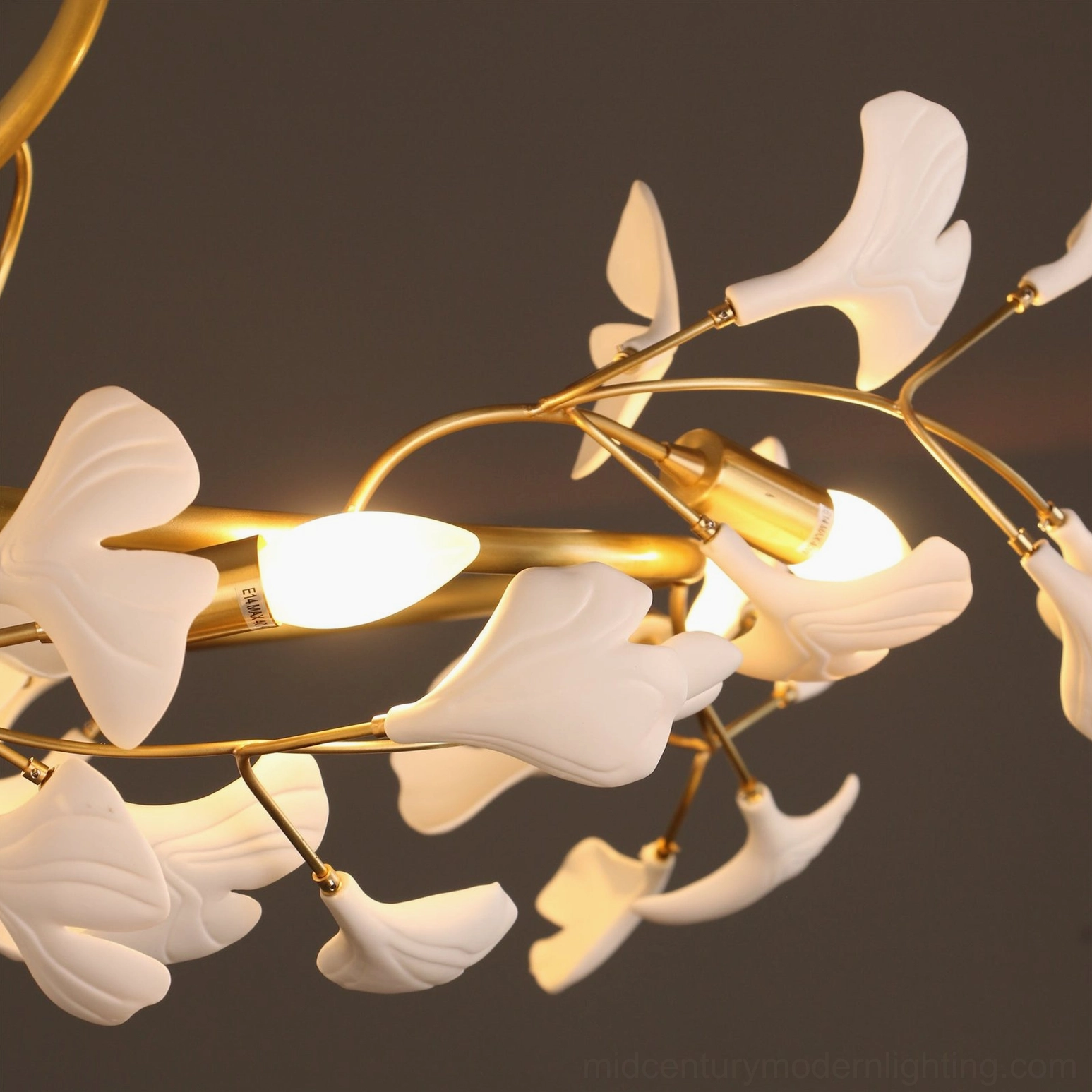 Ginkgo ceiling lamp detail shot showing matte white ceramic leaves and candle bulbs