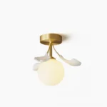 Modern ginkgo leaf ceiling lamp with brass finish and frosted glass globe - front studio view