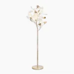 Ginkgo Leaf Floor Lamp full view, sculptural brass-tone metal with ceramic white ginkgo leaves and round marble base on white studio background