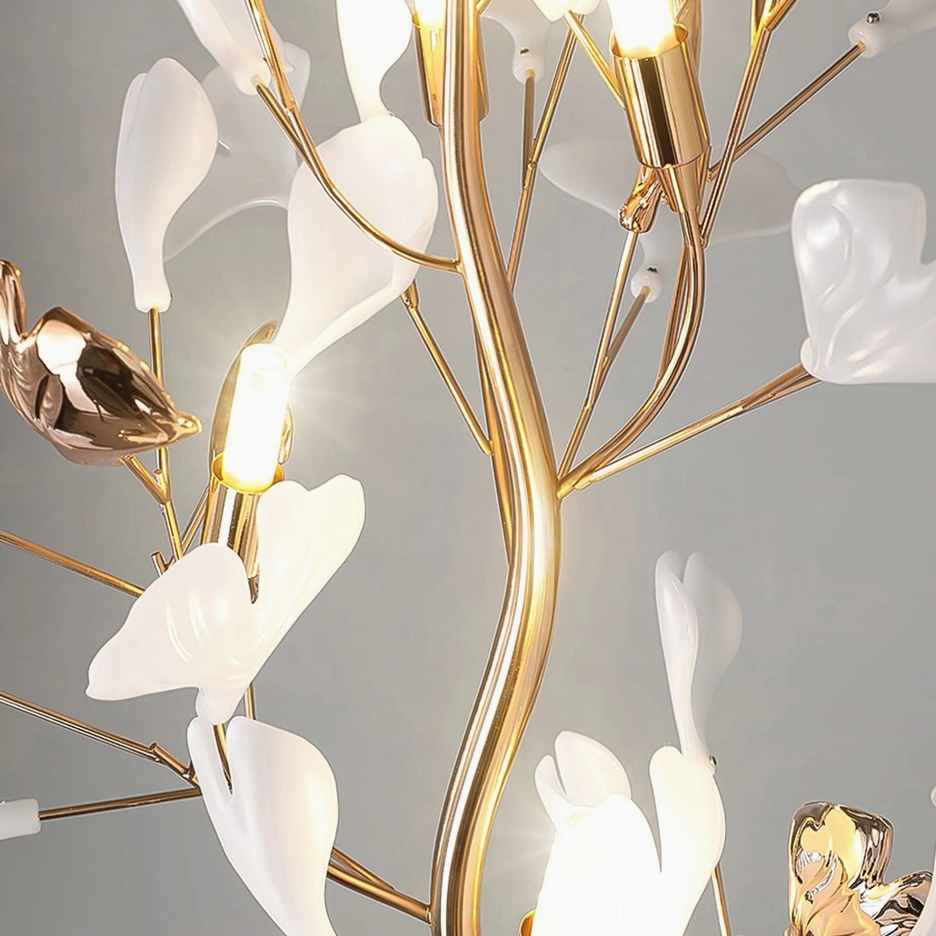 Ginkgo Leaf Floor Lamp illuminated close-up of warm LED bulbs nestled in white ceramic ginkgo leaf fixtures, golden metal frame