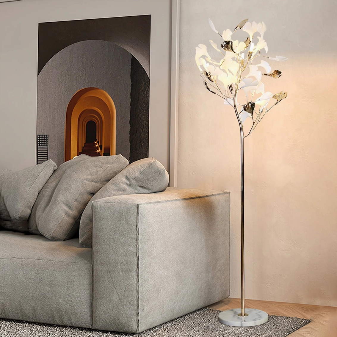 Ginkgo Leaf Floor Lamp in modern living room, side view beside grey upholstered sofa, warm ambient lighting, minimalist luxury interior design