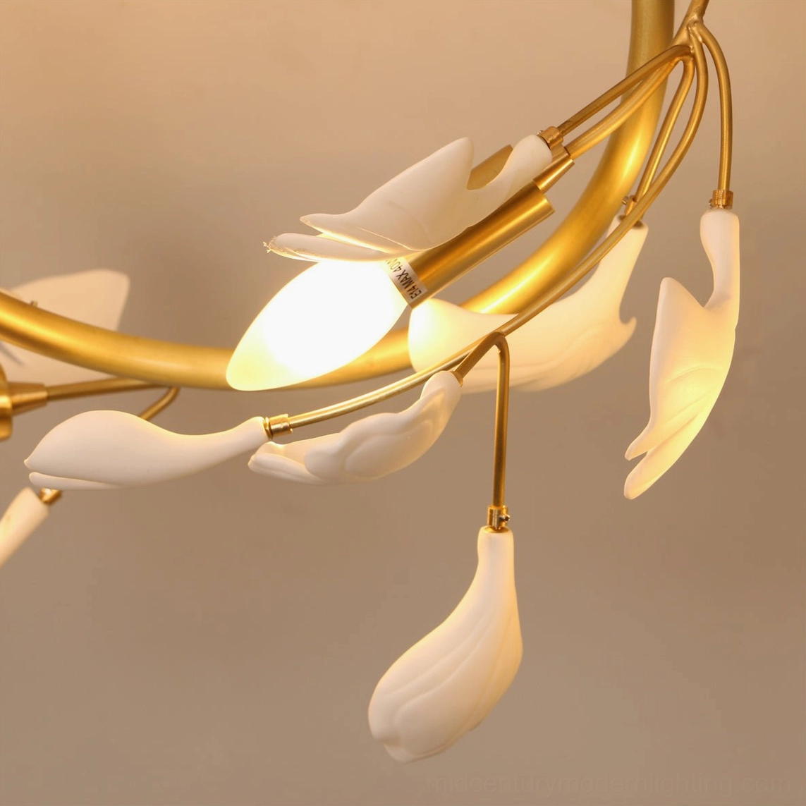 Side view of ginkgo ceiling lamp showing hanging leaf ornaments and polished brass structure