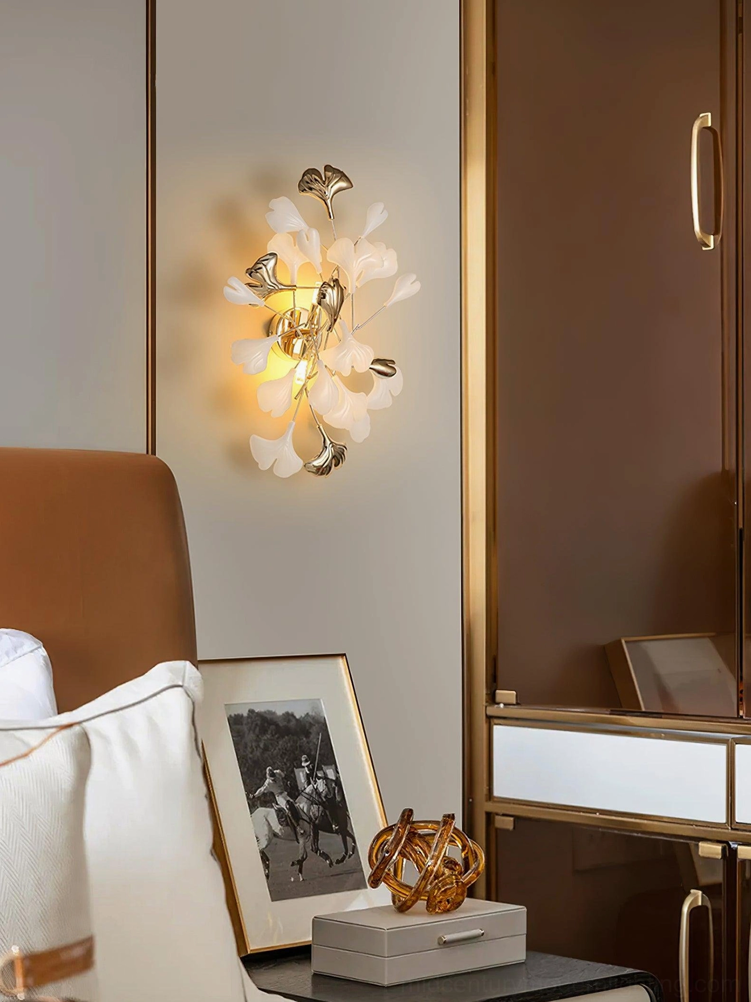 Ginkgo leaf sconce alternative angle, gold metal frame, white ceramic elements, wall-mounted botanical sculpture