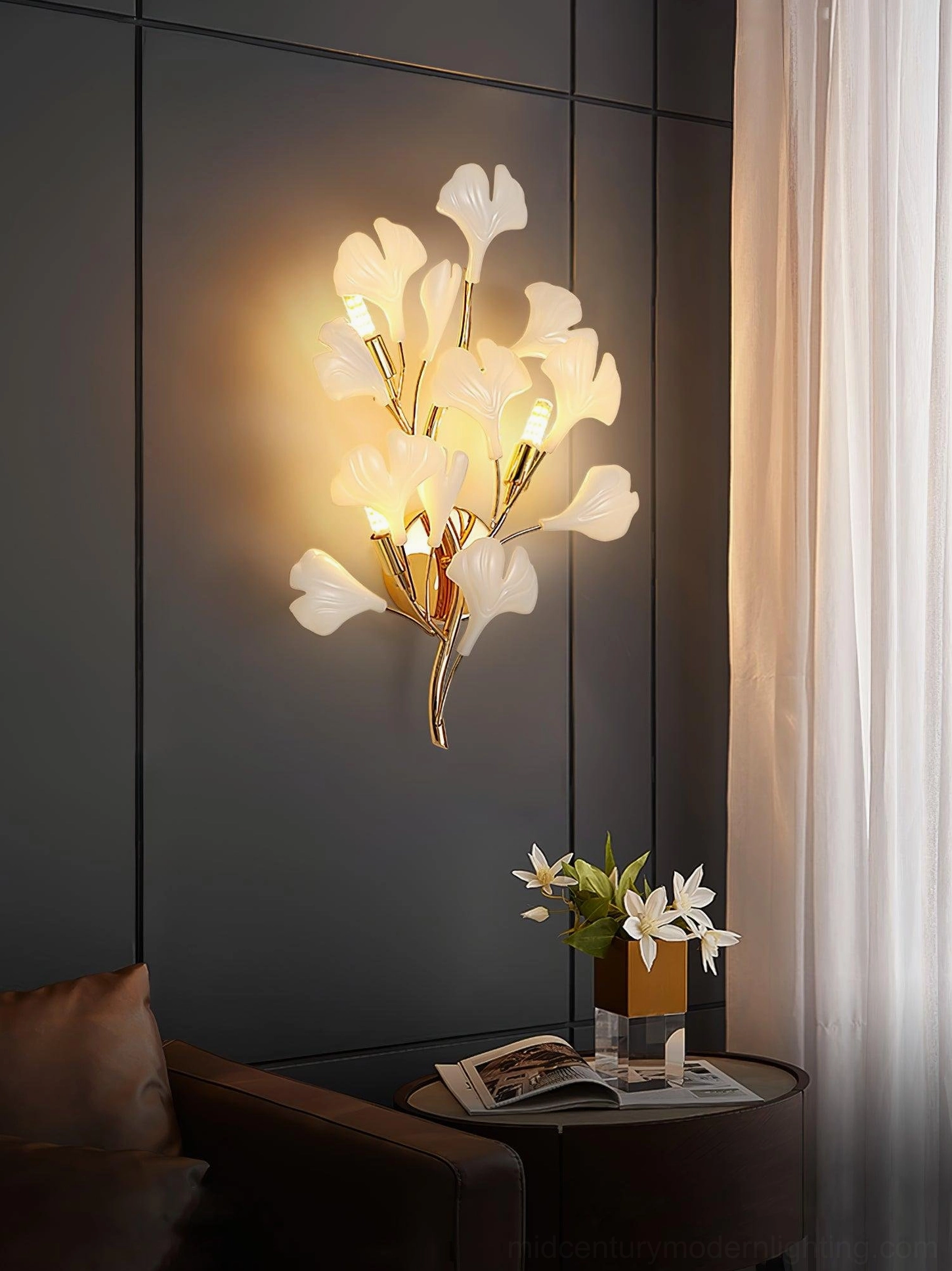 Ginkgo wall sconce mounted in entryway foyer, gold finish luxury modern lighting, botanical statement piece