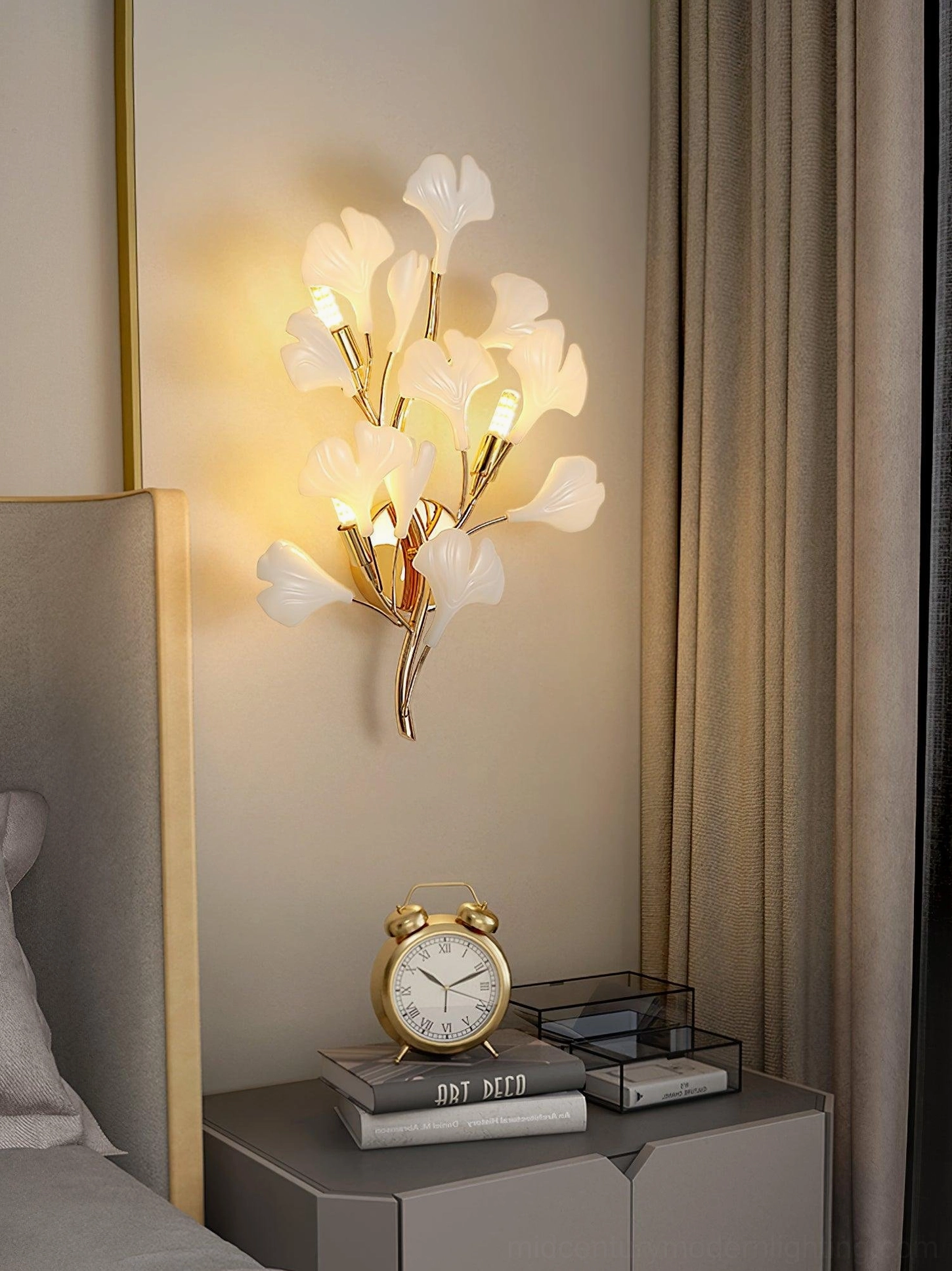Ginkgo wall sconce detail, sculptural leaf form illuminated, gold and white finish, botanical art light