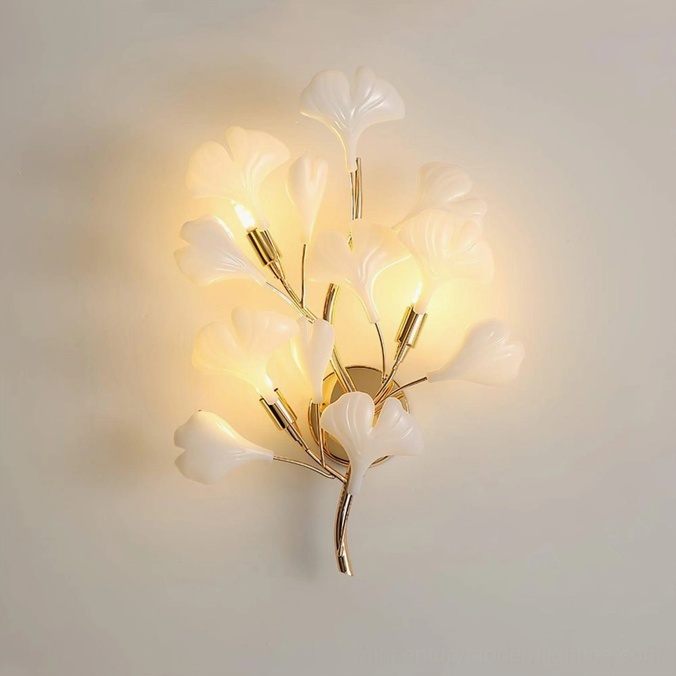 Model A ginkgo wall sconce mounted on bedroom wall, close-up frontal view showing warm ambient light from four G9 sockets