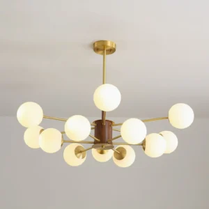 Gino sputnik-inspired chandelier bottom view showing brass framework and frosted glass orbs with warm lighting