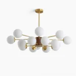 Gino mid-century modern glass globe chandelier with brass arms and walnut wood hub, front studio view