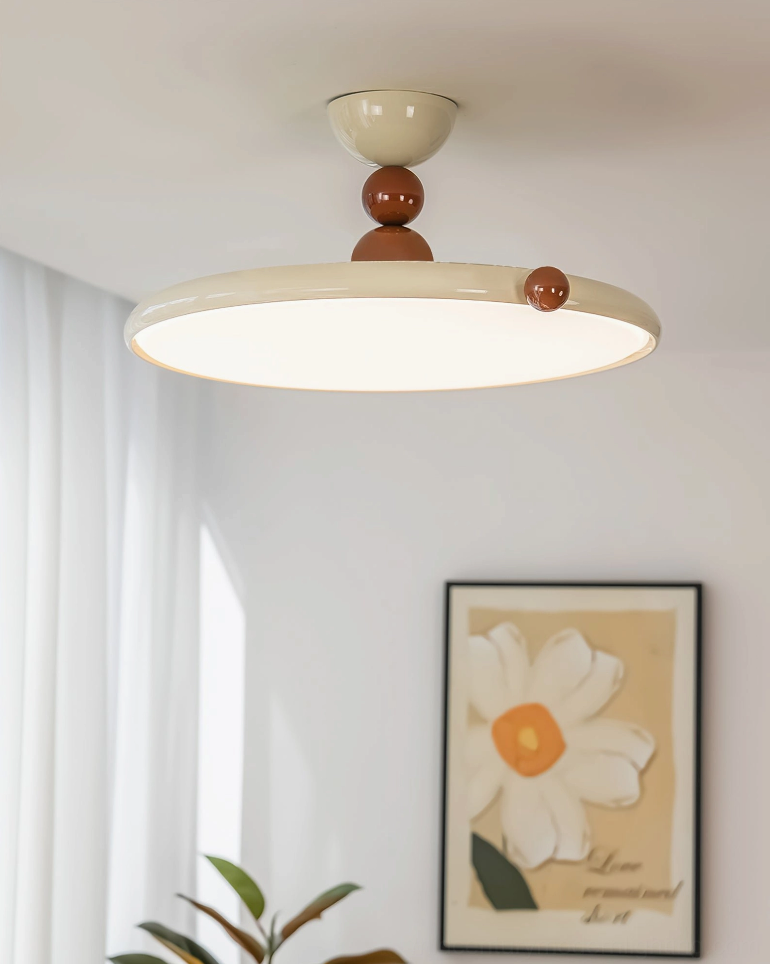 Gino flush mount ceiling lamp in residential home interior, warm ambient lighting in living room with wall art