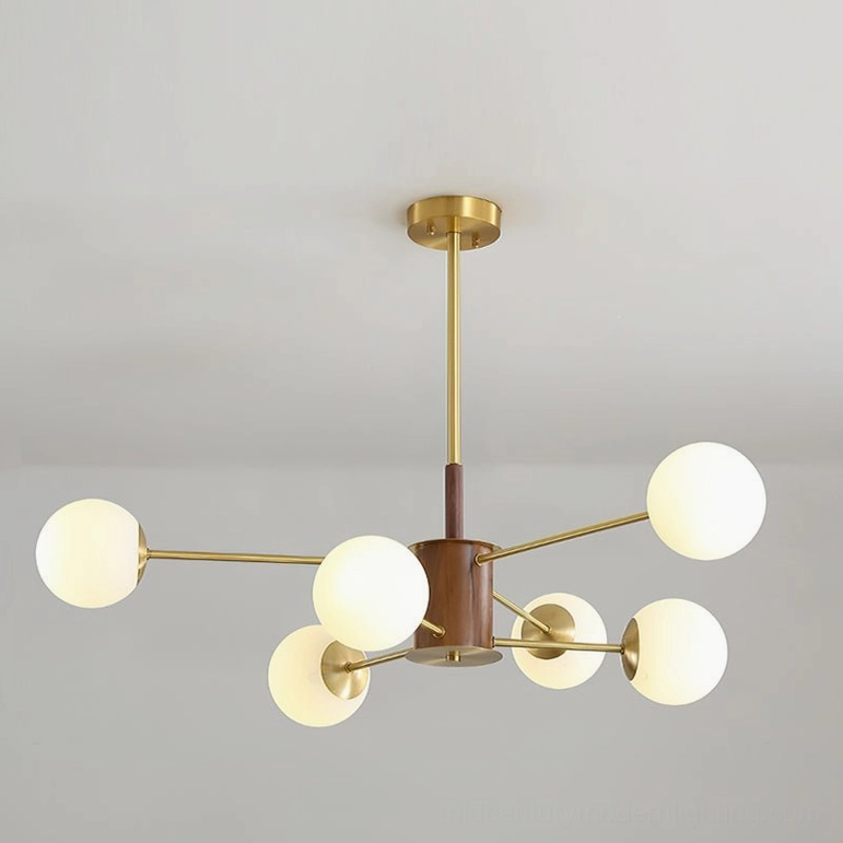 Gino glass chandelier elegant sculptural design brass framework walnut hub frosted orbs