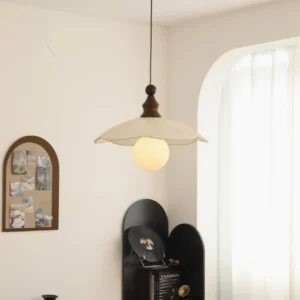 Giselle pendant light in minimalist living room - organic pleated shade illuminating contemporary interior space