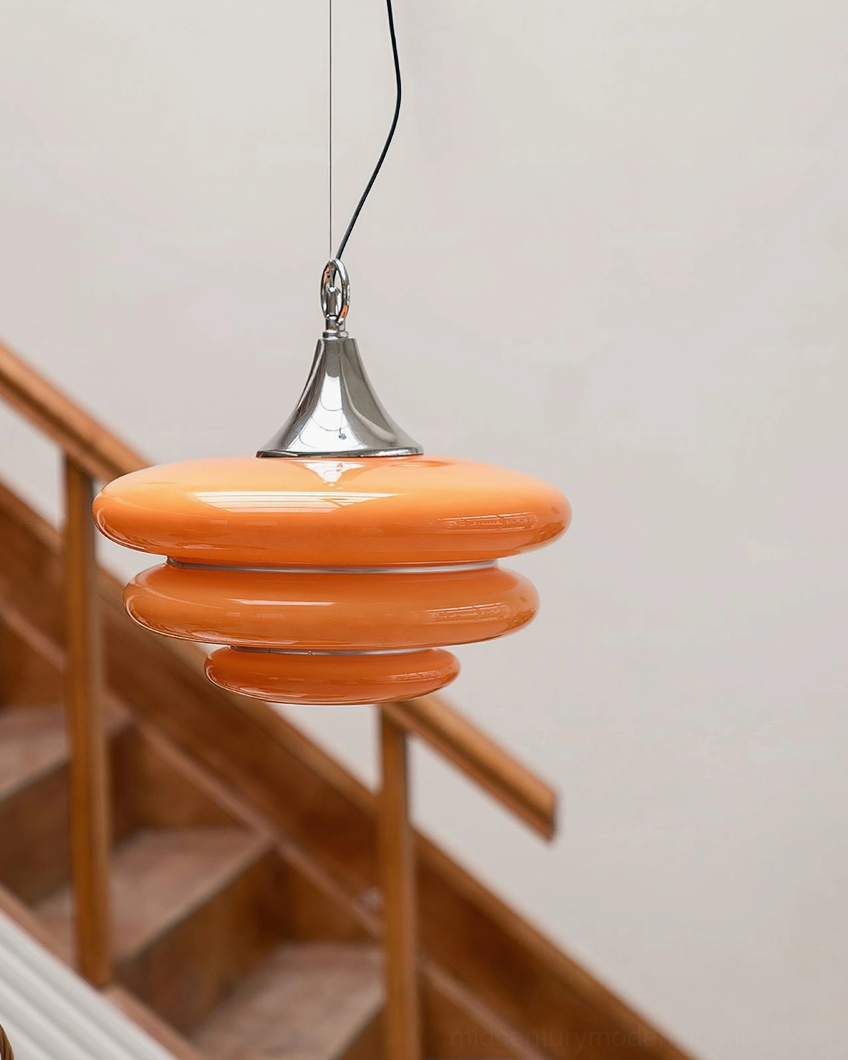 Mid-century modern orange tiered pendant light multiple angle product showcase lifestyle composition