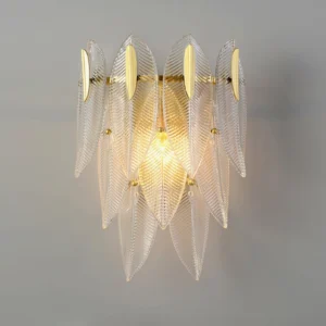 Model A Giulia brass wall sconce overhead view showing dual E14 bulb configuration and glass texture detail