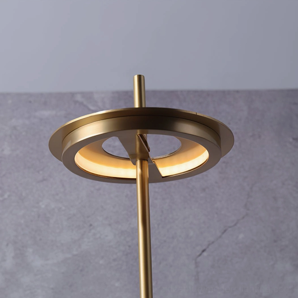 Polished brass Giulietta table lamp showing iconic floating disc suspended above circular base