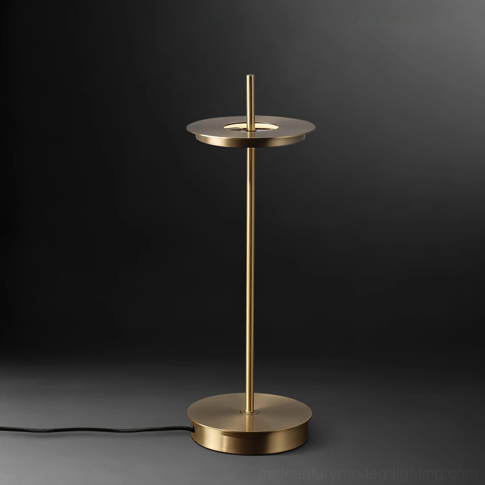 Giulietta minimalist table lamp in brass finish on workspace showing Italian design craftsmanship