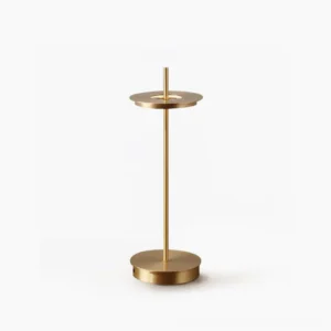 Giulietta minimalist brass table lamp with floating metal disc and slender rod on circular base, front studio view