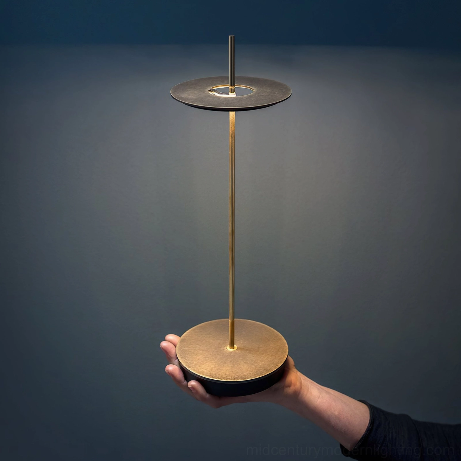 Giulietta table lamp warm 3000K glow creating intimate ambiance on contemporary dining surface