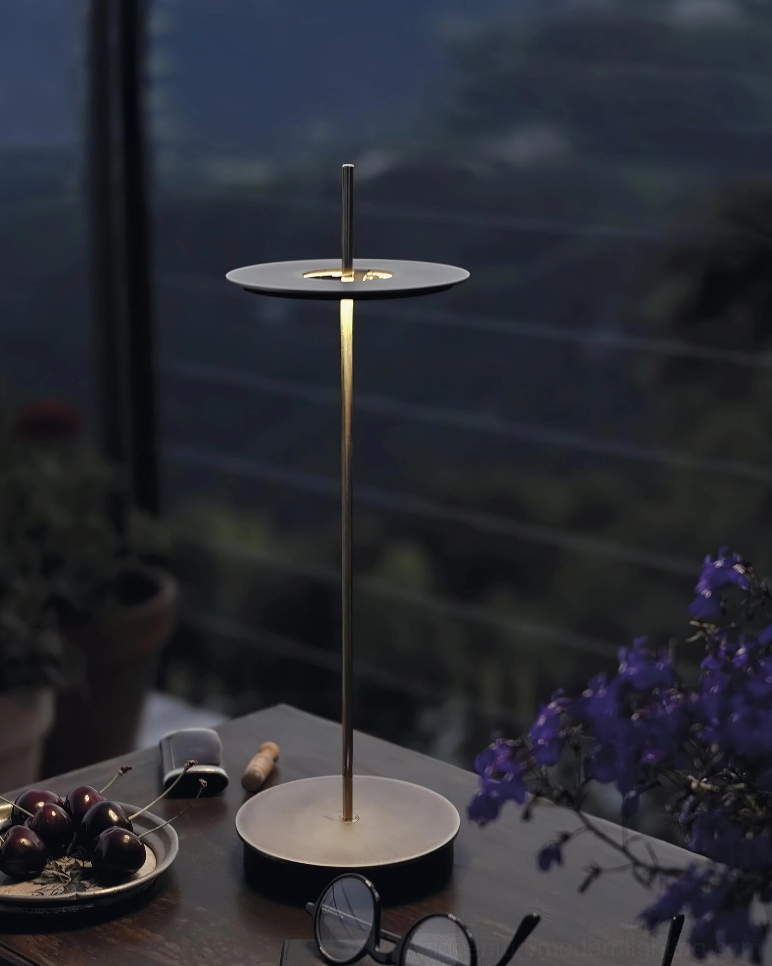 Multiple Giulietta brass table lamps creating sophisticated ambient lighting for dinner party tablescape