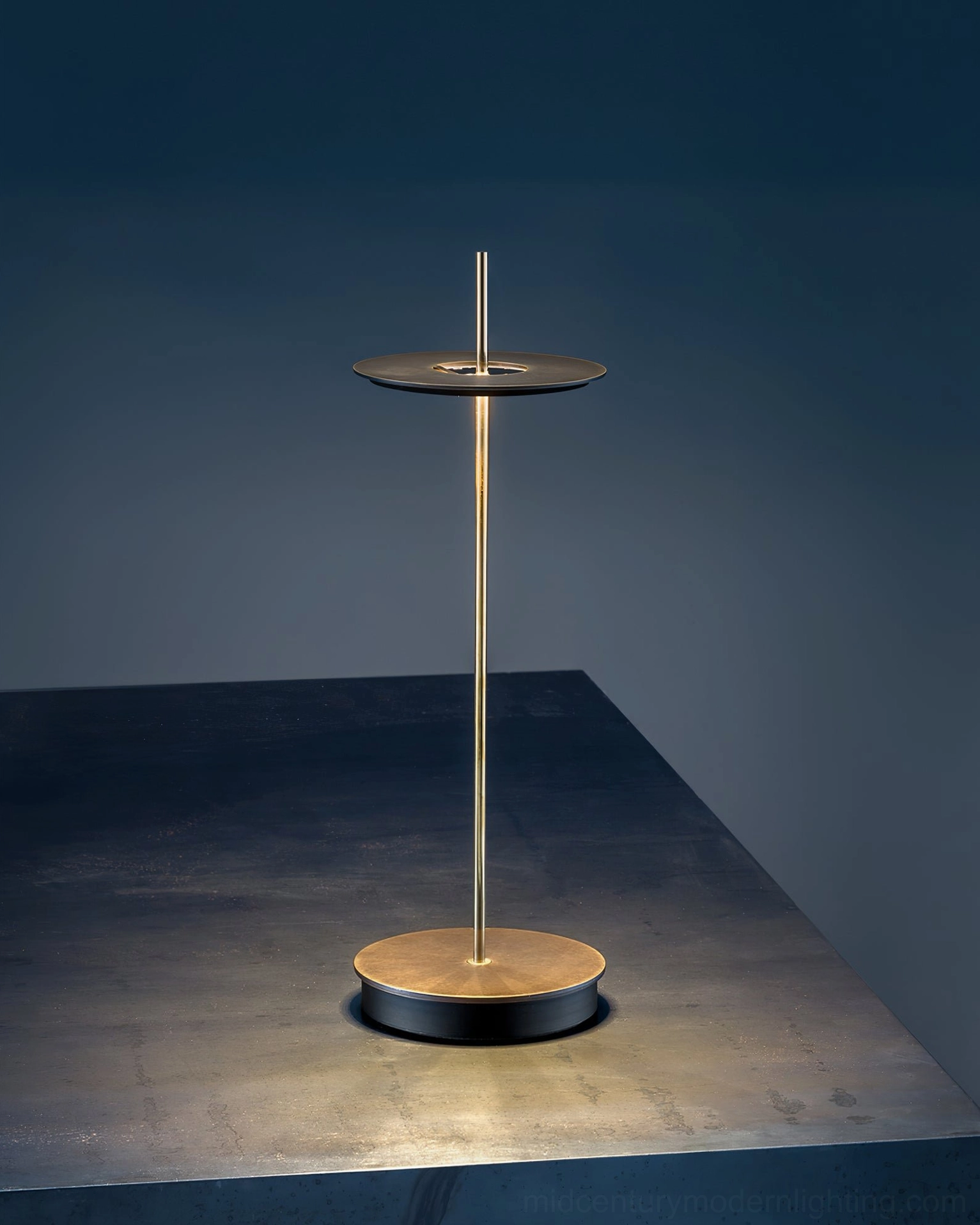 Multiple Giulietta table lamps arranged at varying heights for gallery-style lighting installation