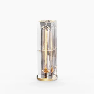 Glacon Cylinder optical crystal table lamp with 8 exposed filament bulbs, polished brass base, studio view
