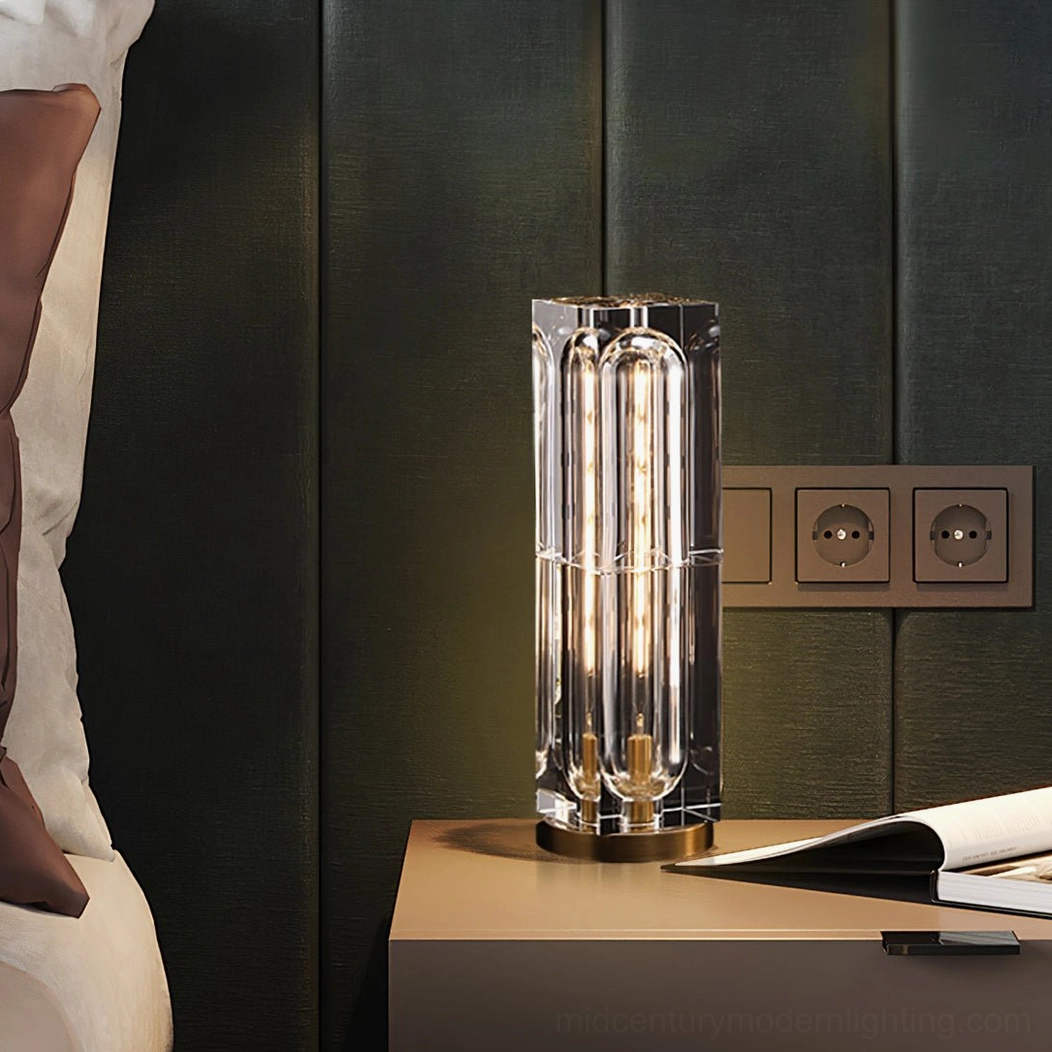 Glacon Cylinder lamp on bedroom bedside table, warm filament glow against green wall