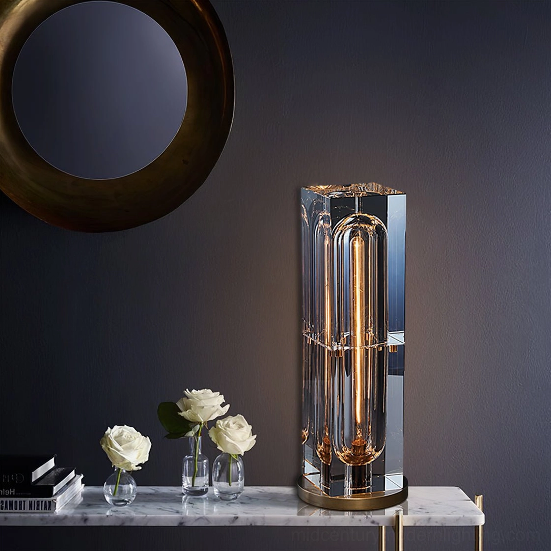 Glacon Cylinder lamp illuminated showing warm golden filament glow through crystal