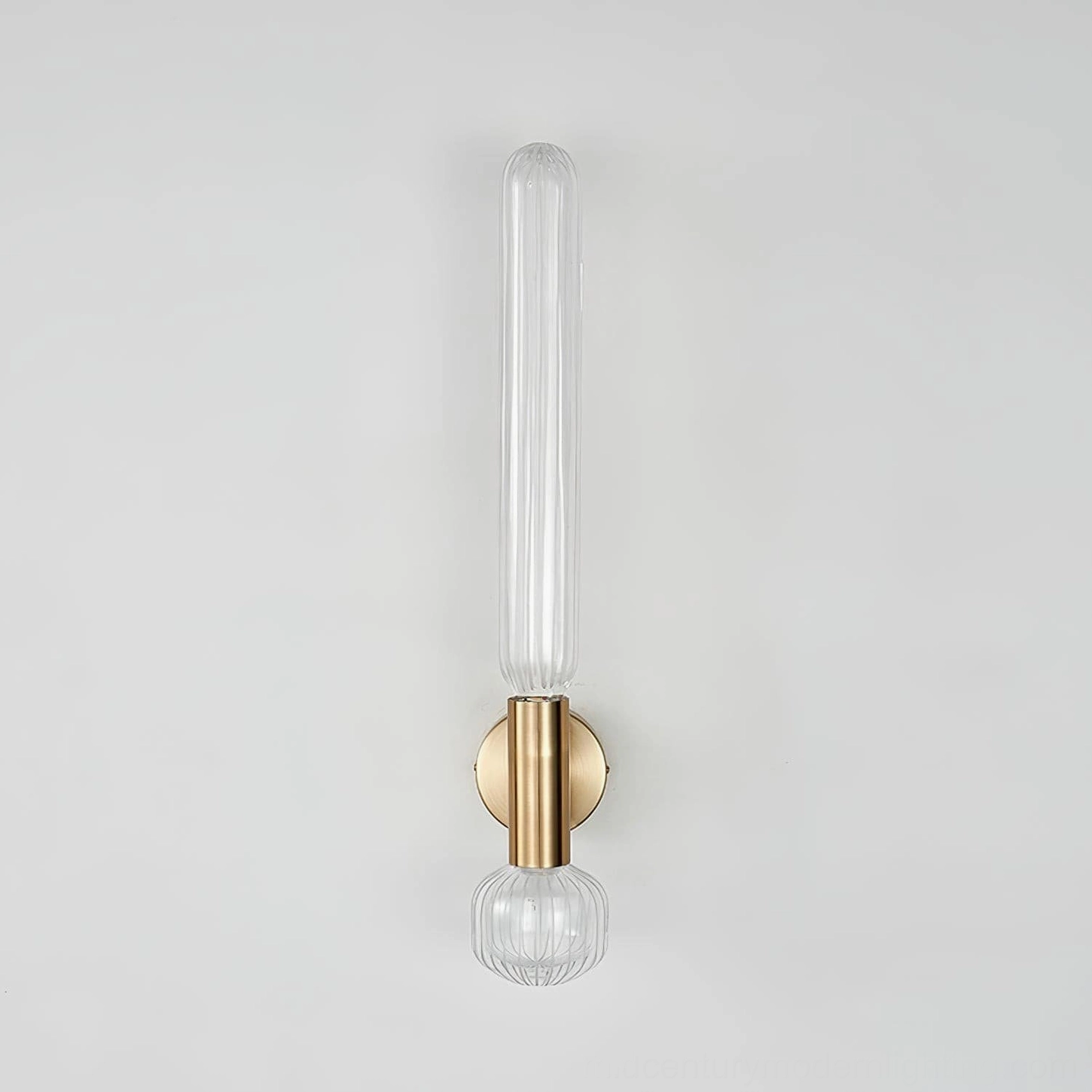Glaive unlit wall sconce front profile, slim vertical ribbed glass shade with round brass backplate