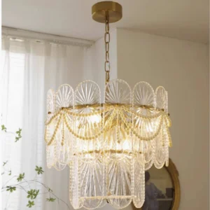 Vintage-inspired glass chandelier with ribbed panels and pearl beads installed in residential living room with natural light