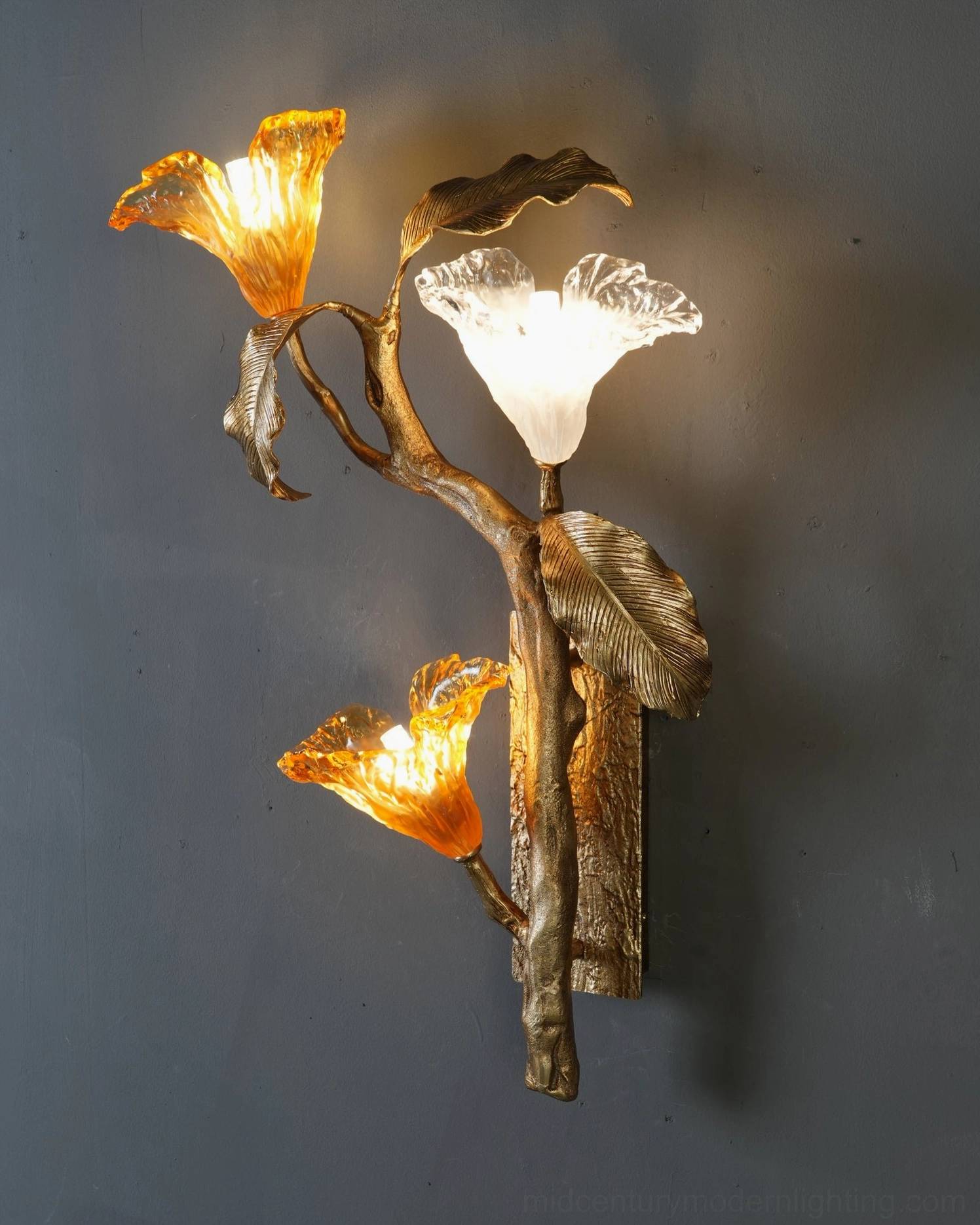 Hand-shaped glass lily bloom close-up showing individual artisan glasswork and amber tone detail