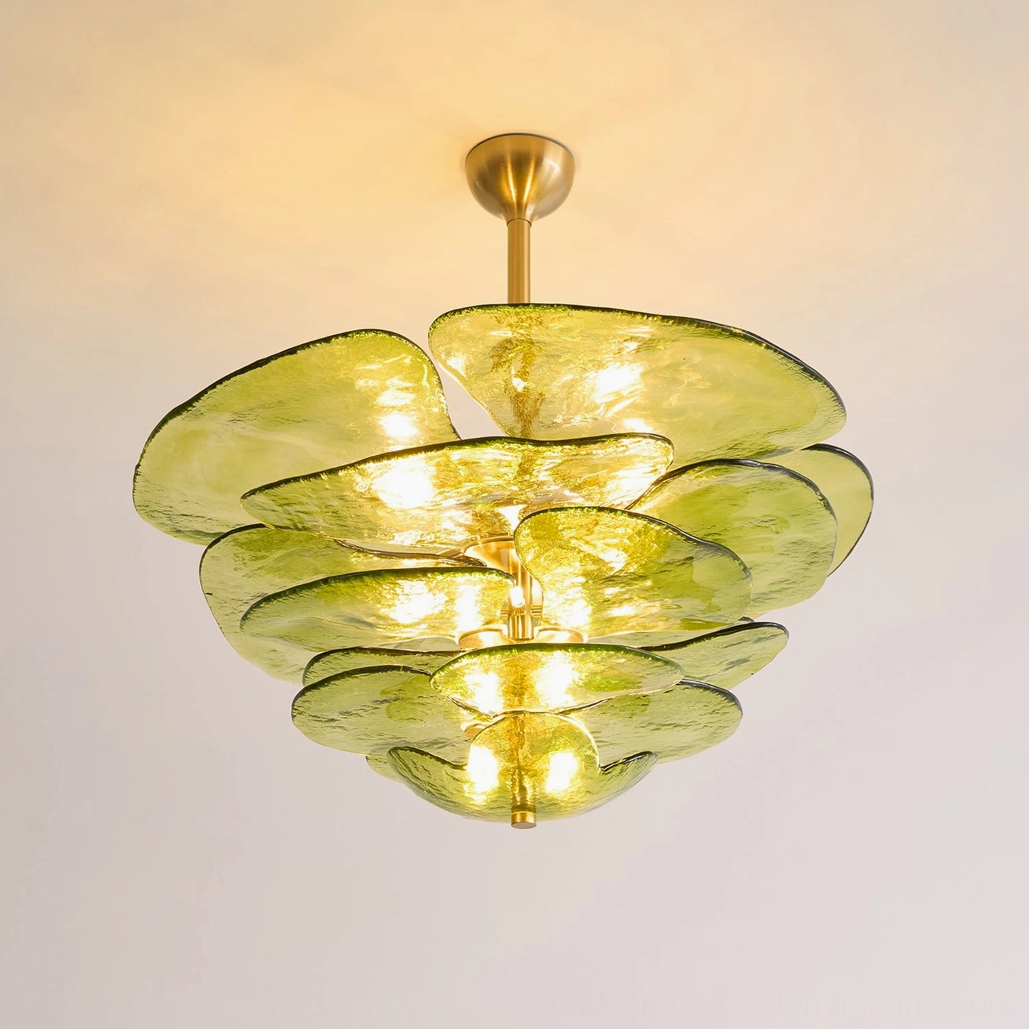 Glass lotus petal chandelier with organic flower-inspired design and brass mounting system