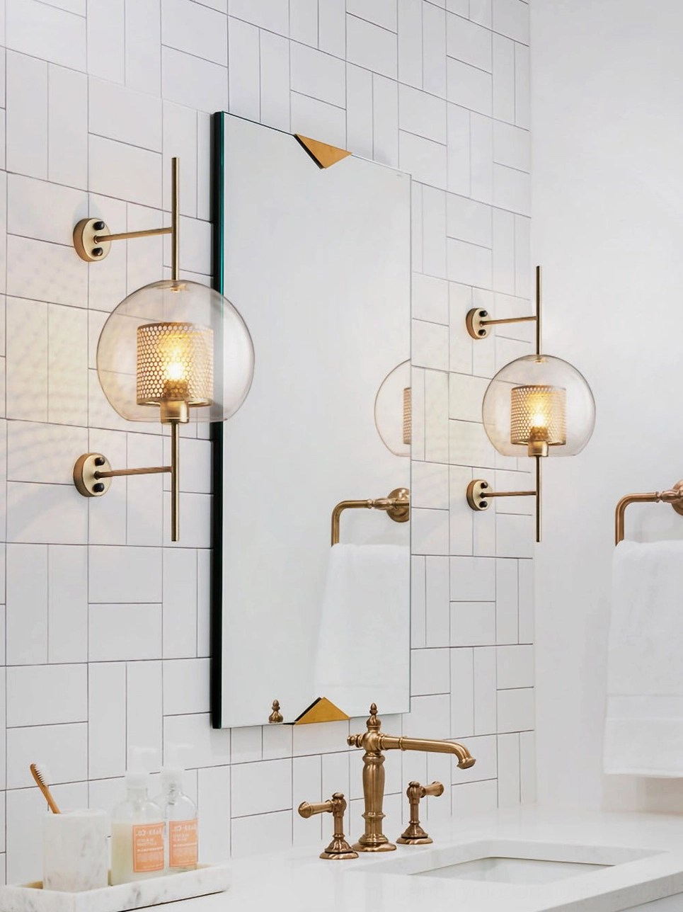 Modern glass sconce mounting system showing hardware installation and bracket