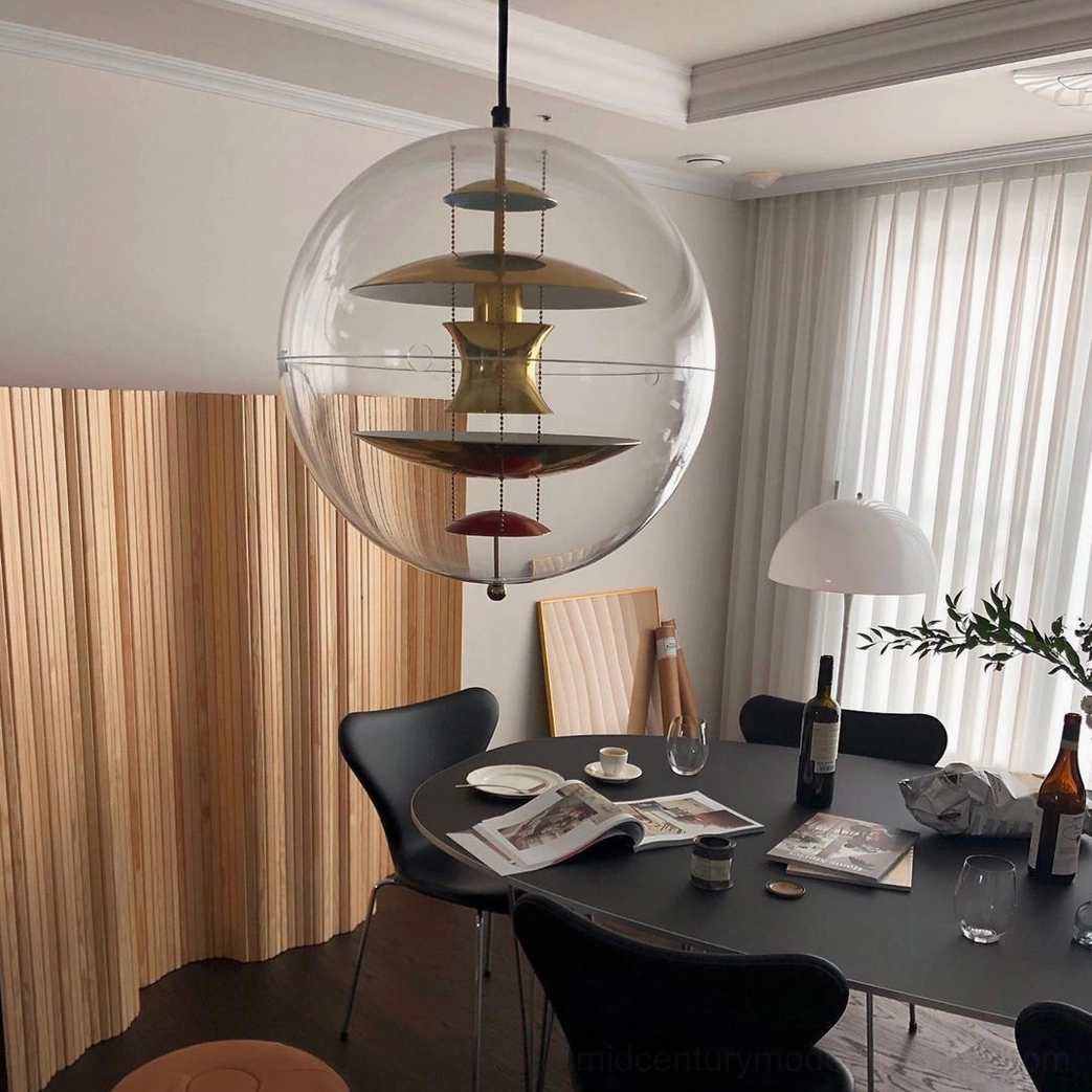 Globe pendant lamp with clear acrylic sphere and visible internal reflector mechanism