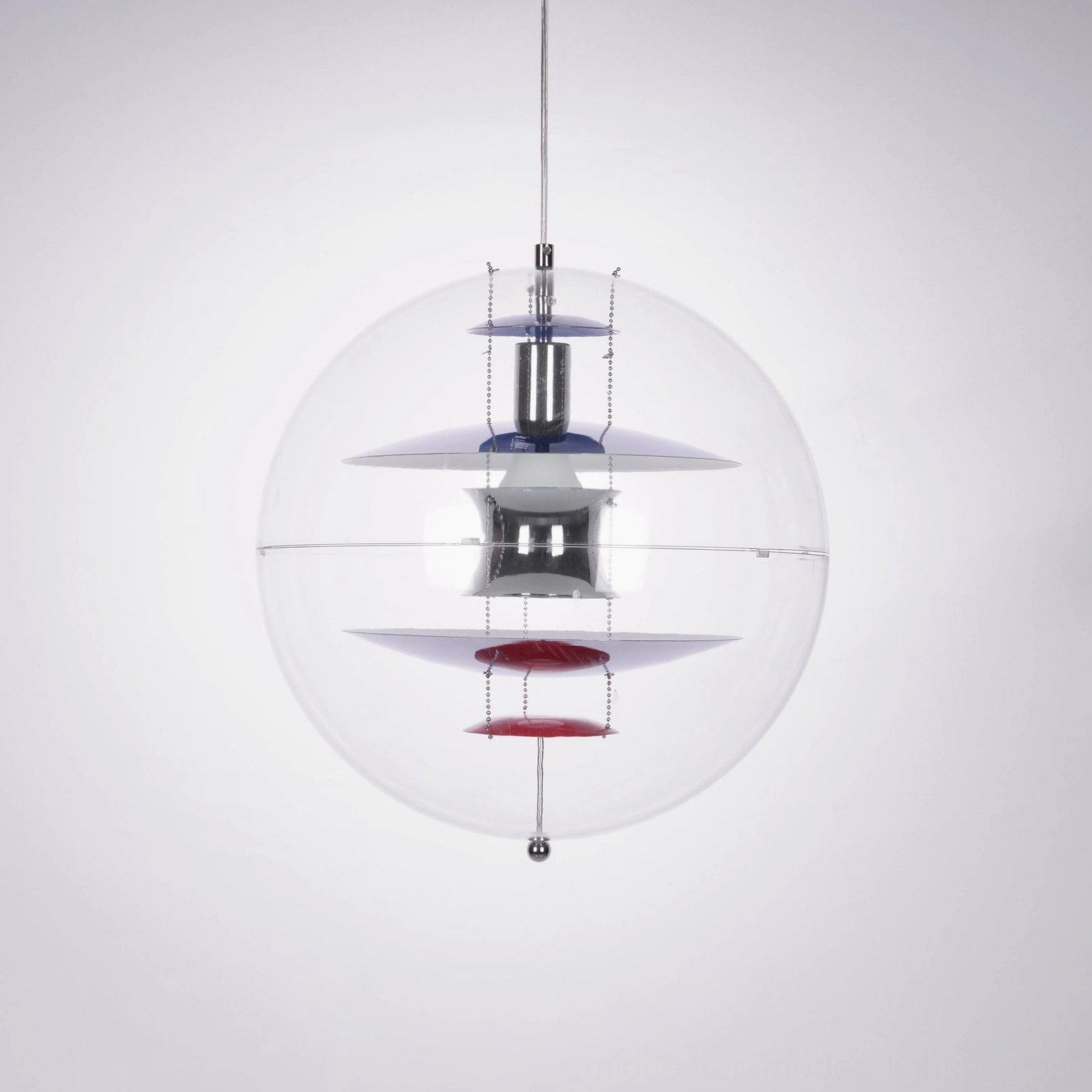 Globe suspension lamp with blue top accent and red lower component, studio overhead view