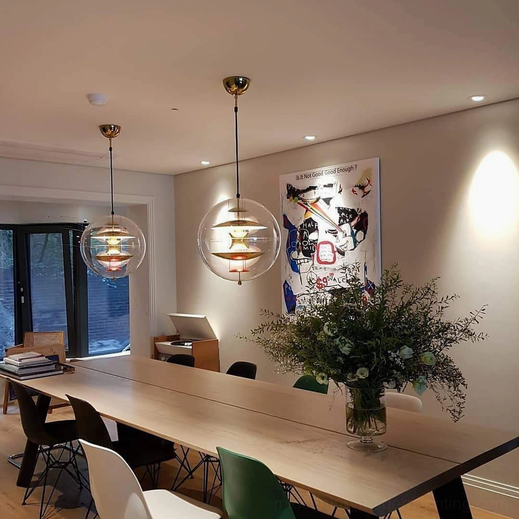 Globe pendant fixture available in multiple finish colors and sizes