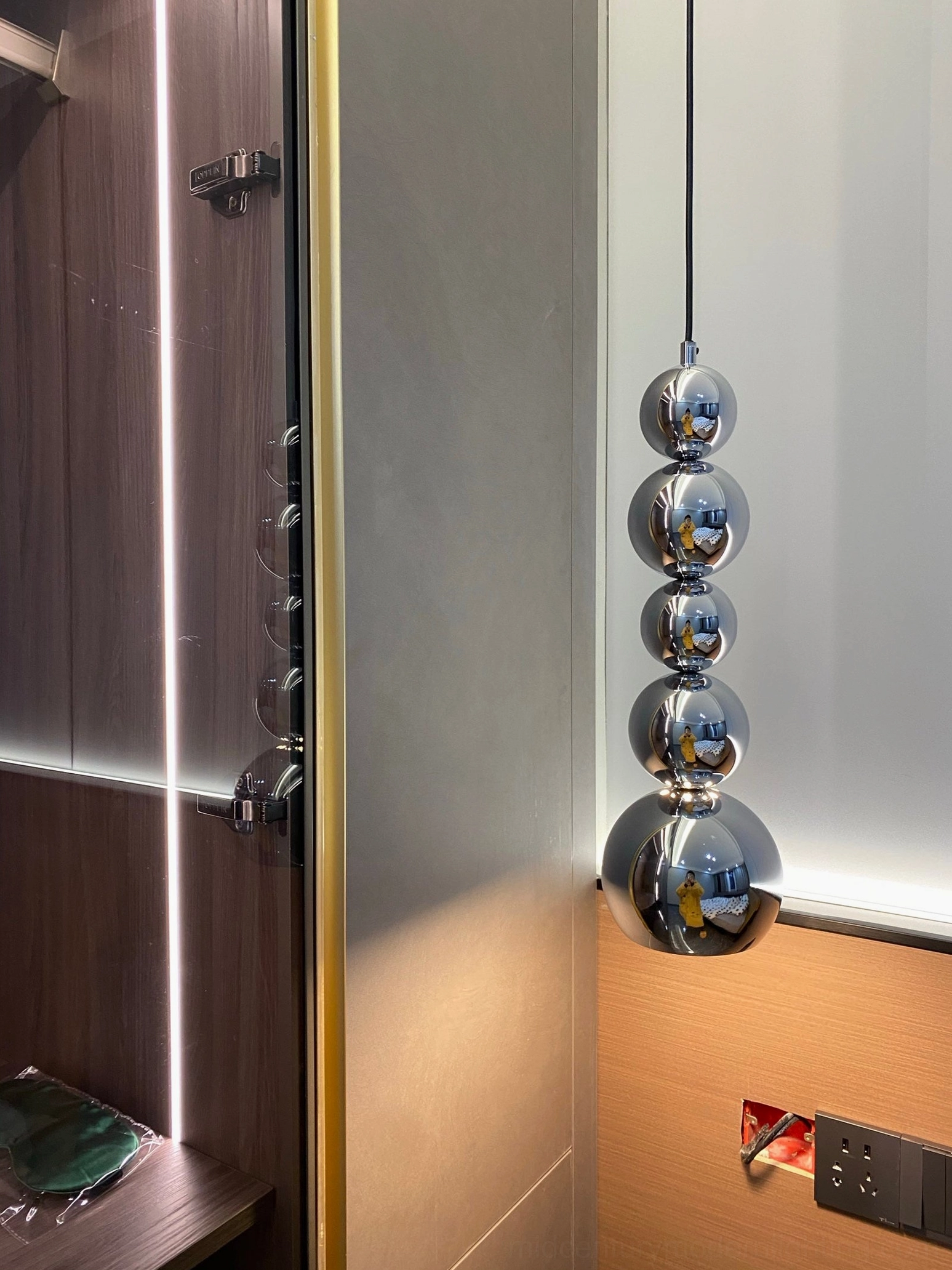 Globe pendant light demonstrating scale and proportion in interior ceiling installation