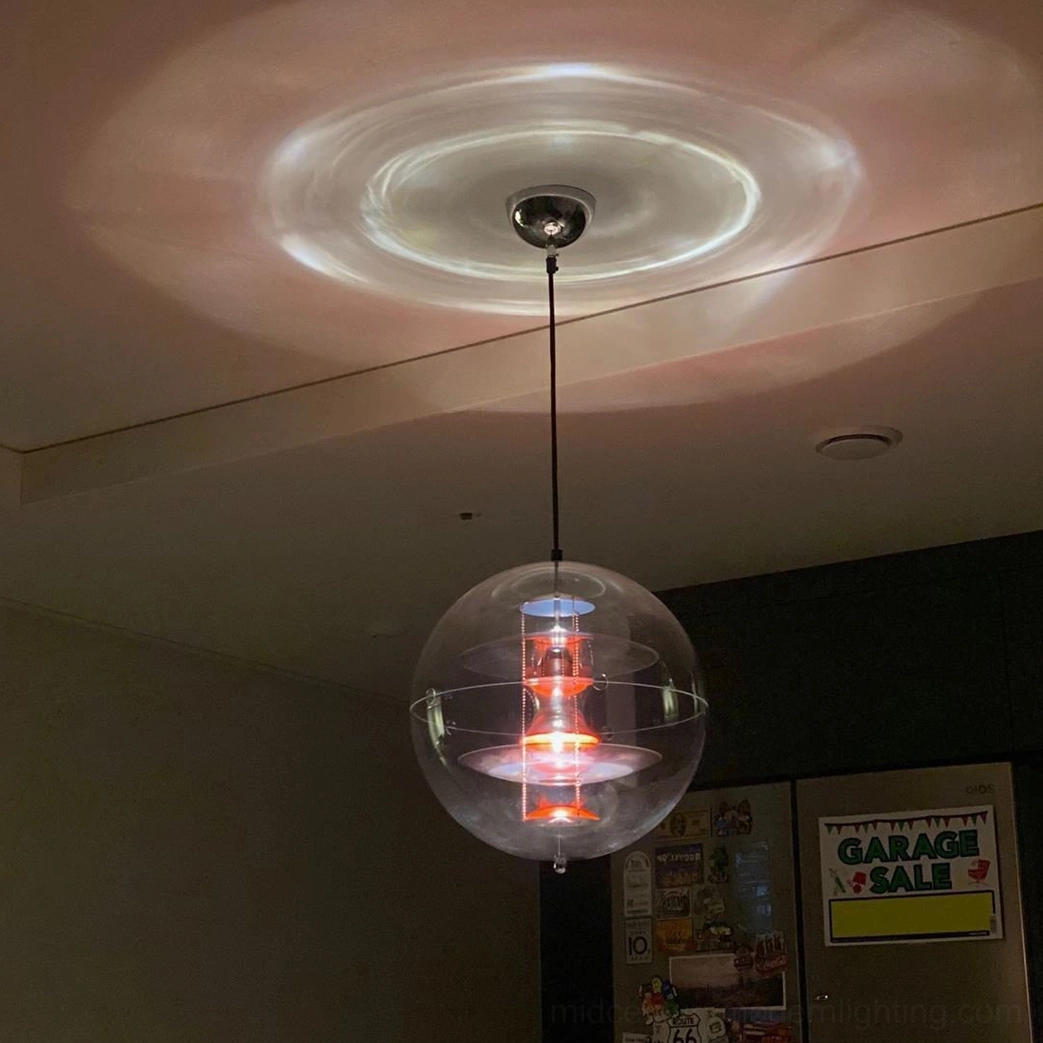 Globe pendant lighting fixture in home decor setting with modern furnishings