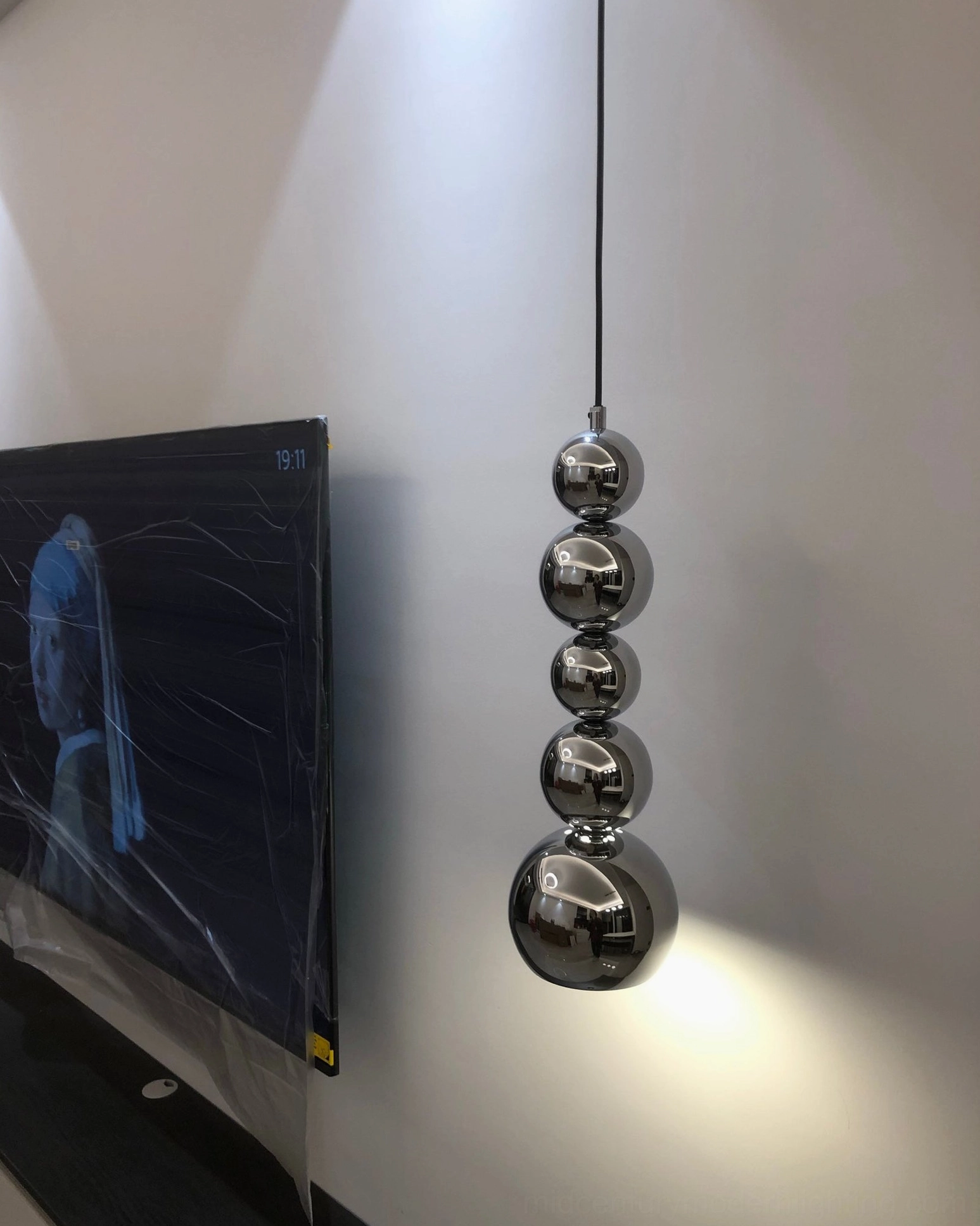 Globe pendant light in various room applications showcasing versatile interior design compatibility