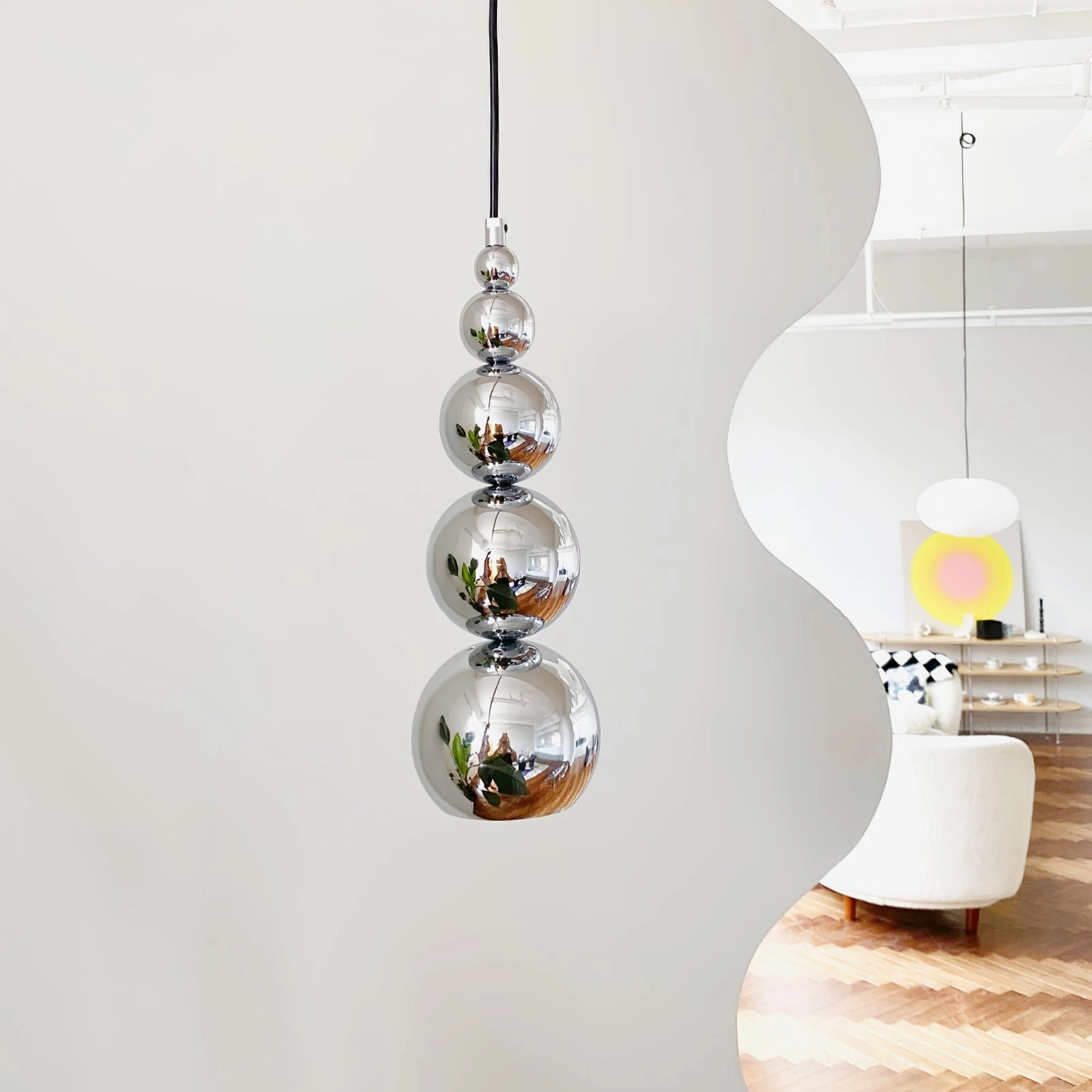 Globe pendant lighting fixture compatible with standard wall switches, universal voltage operation