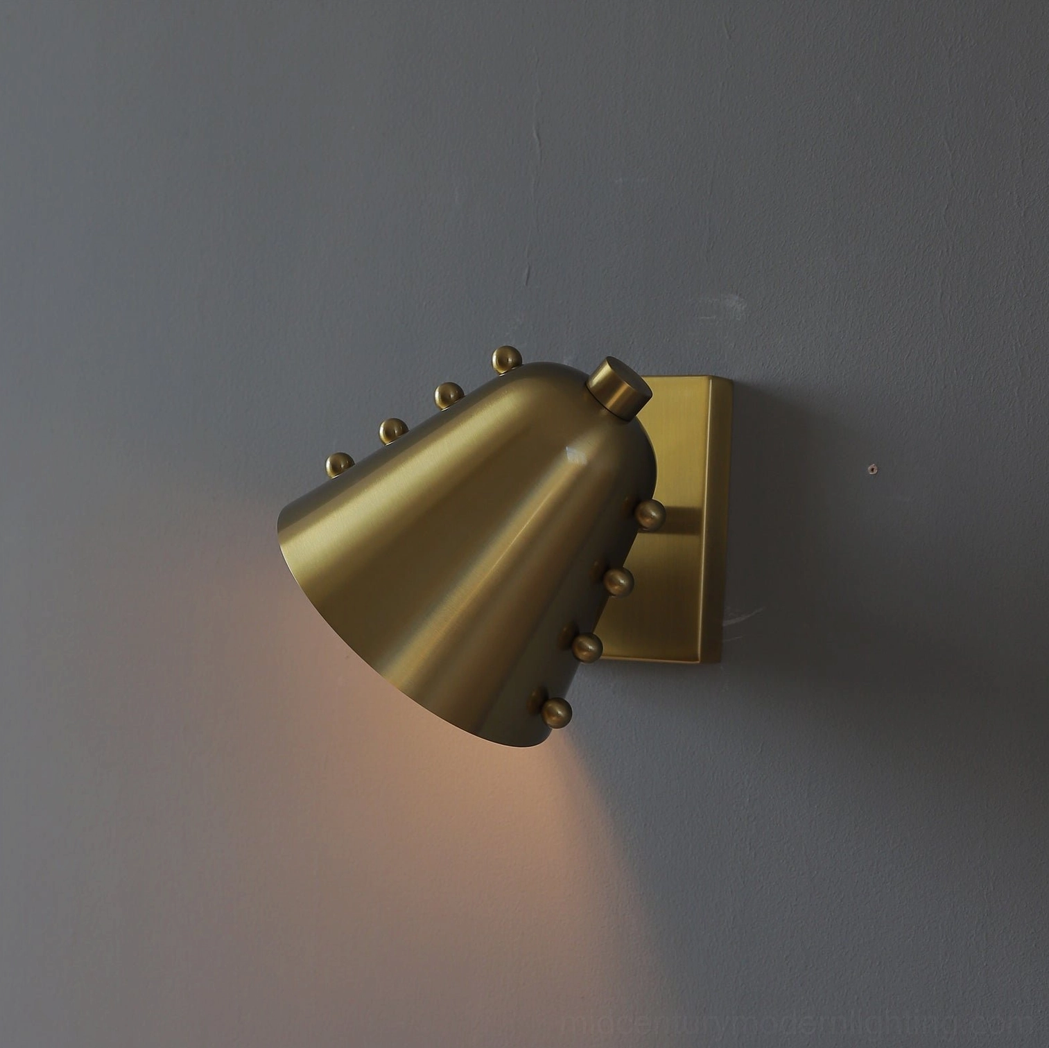 Gold and black two-tone sconce artistic close-up highlighting finish contrast and quality