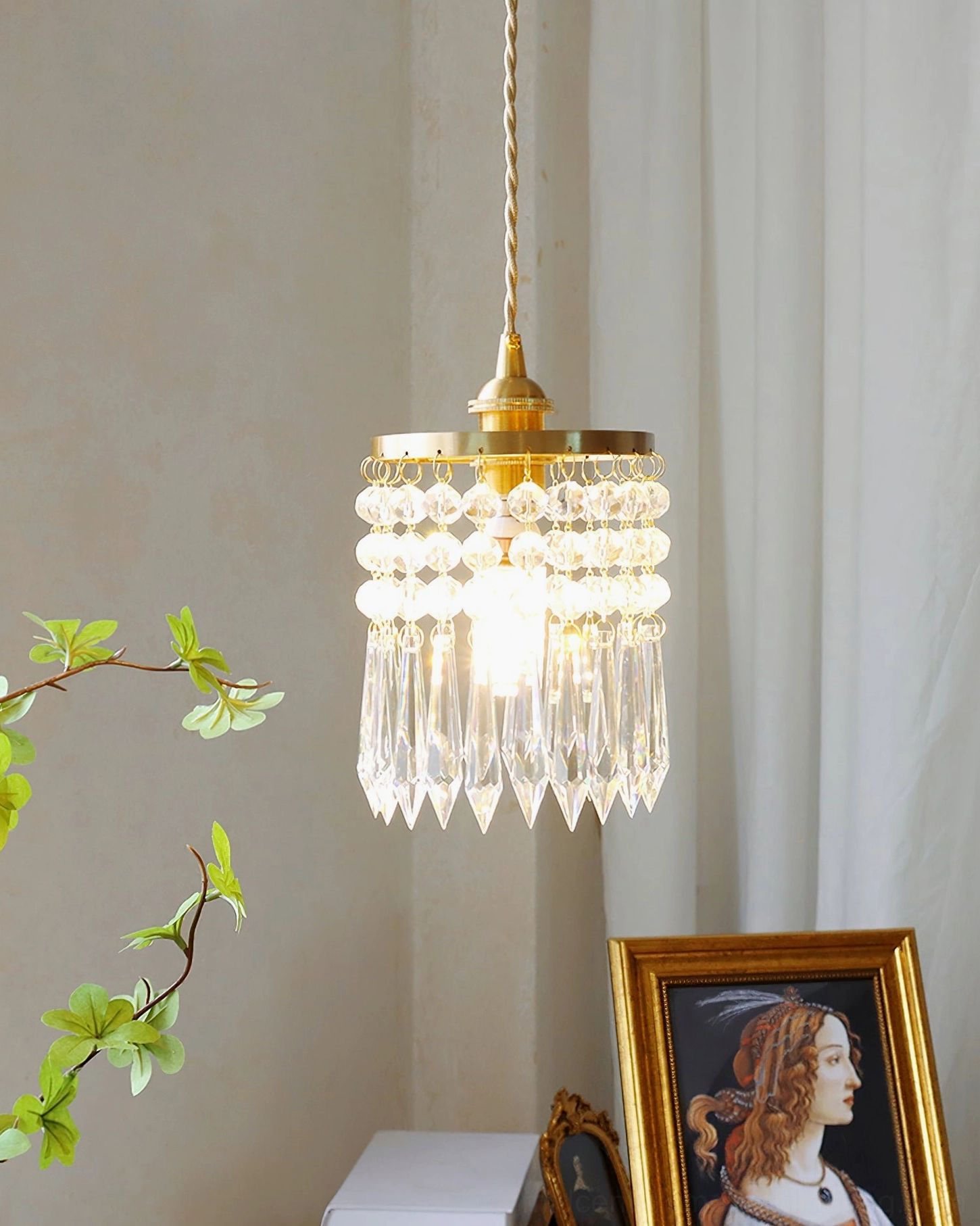Gold brass crystal pendant with twisted cord, elegant home interior display