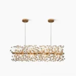 Crystal Firework Chandelier with radiant starburst design, gold metal frame with faceted clear crystal pendants, overhead view