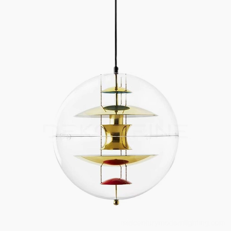 Globe pendant light in gold tone finish over dining area with transparent acrylic sphere