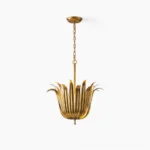 Leaf pendant light with gold finish in overhead studio view showing sculptural metal petals