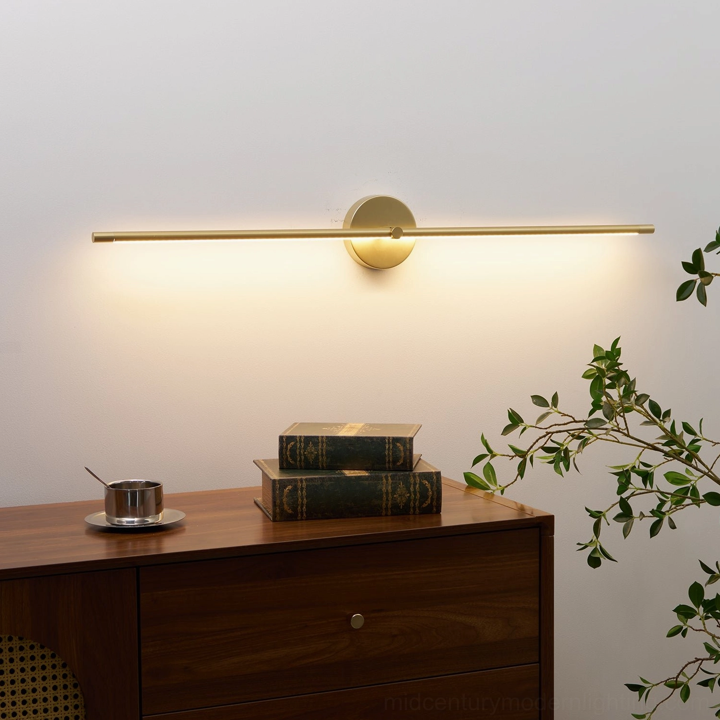 Elegant matte gold linear wall lamp with warm ambient glow and minimalist aesthetic
