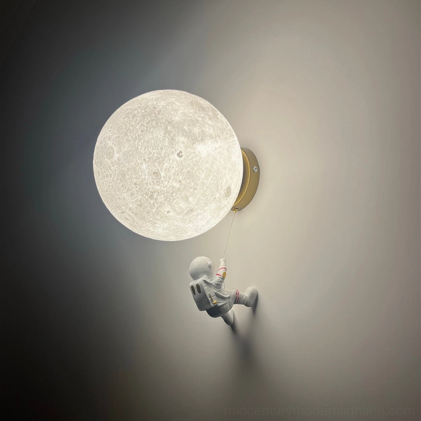 Gold finish lunar wall sconce with luxury interior styling and metallic accents